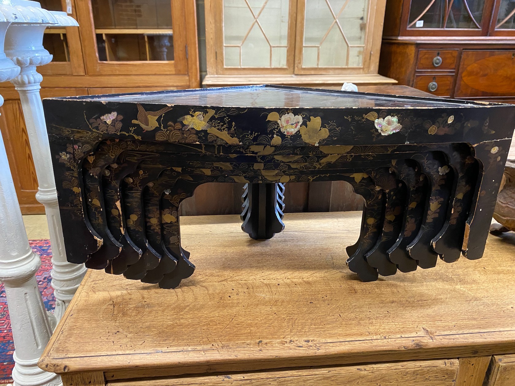 A Chinese export lacquer sectional six tier corner shelf, width 65cm, depth 38cm